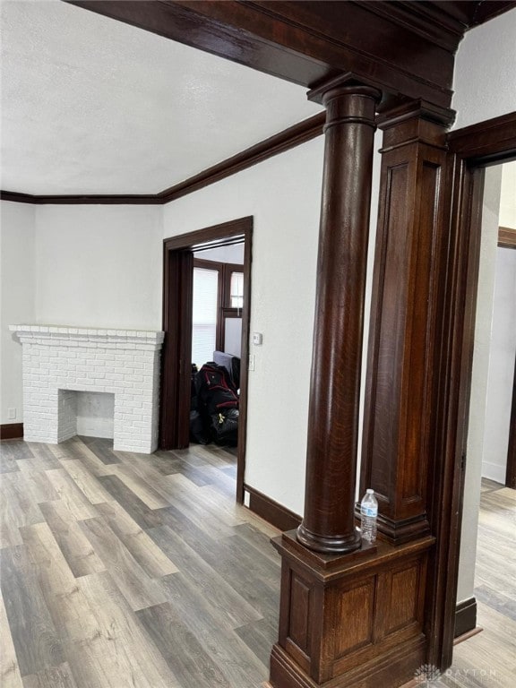2312 Parkland Ave, Dayton, OH 45405 - unfurnished living room with baseboards, light wood-style floors, and crown molding