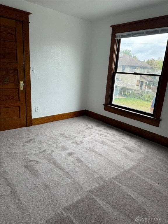 2312 Parkland Ave, Dayton, OH 45405 - unfurnished room featuring baseboards and carpet floors