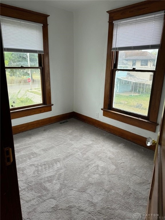 2312 Parkland Ave, Dayton, OH 45405 - spare room with baseboards, visible vents, and carpet
