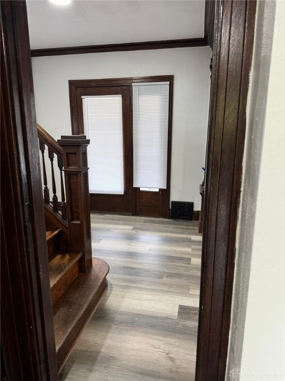 2312 Parkland Ave, Dayton, OH 45405 - entrance foyer featuring stairs, wood finished floors, and crown molding
