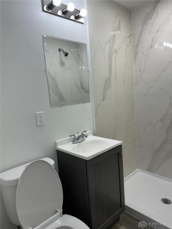 2312 Parkland Ave, Dayton, OH 45405 - bathroom with toilet, vanity, and a marble finish shower