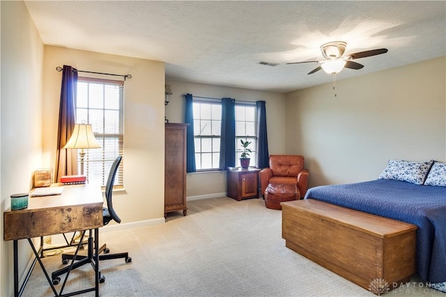 bedroom featuring visible vents, ceiling fan, carpet, and baseboards