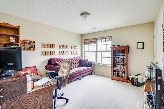 home office featuring visible vents and carpet floors