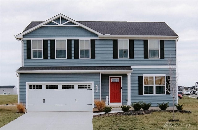 4249 Willow Hills Dr, Dayton, OH 45404 - view of front facade with driveway, a front lawn, and a garage
