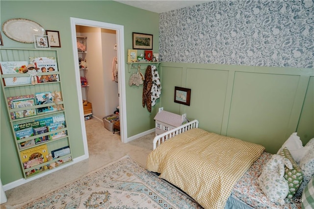 4249 Willow Hills Dr, Dayton, OH 45404 - bedroom with carpet, a wainscoted wall, a decorative wall, wallpapered walls, and baseboards