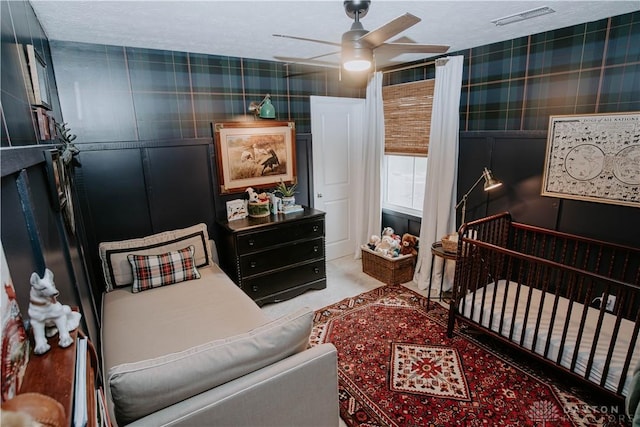 4249 Willow Hills Dr, Dayton, OH 45404 - carpeted bedroom with wallpapered walls and ceiling fan