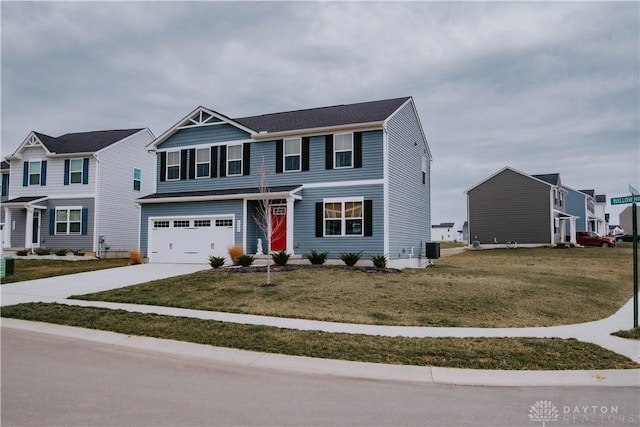 4249 Willow Hills Dr, Dayton, OH 45404 - view of front of property with a garage, concrete driveway, a front yard, and a residential view