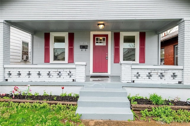 doorway to property with covered porch