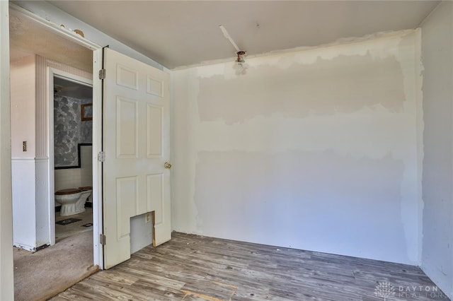 spare room with wood finished floors