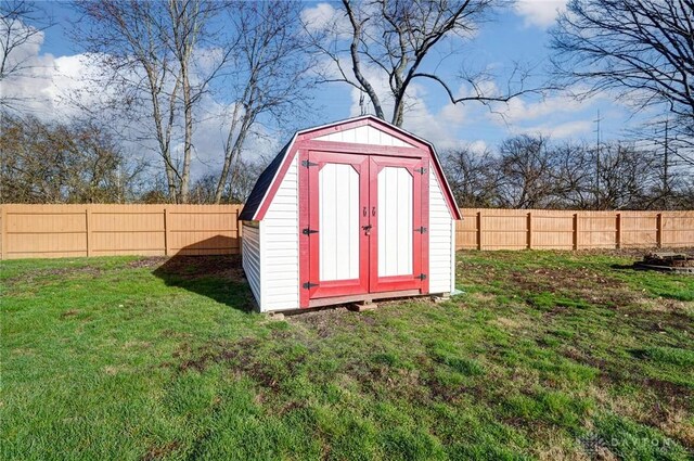 view of shed featuring a fenced backyard