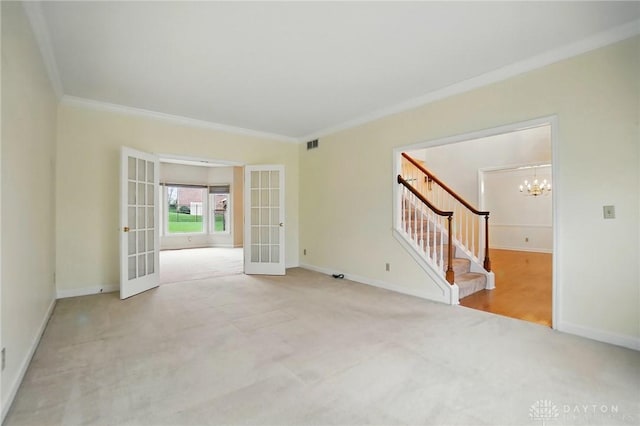 433 Vincent Ct, Middletown, OH 45042 - carpeted spare room with french doors, stairs, a chandelier, crown molding, and baseboards