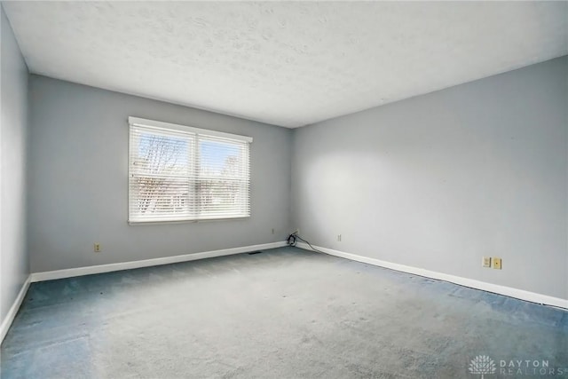433 Vincent Ct, Middletown, OH 45042 - carpeted empty room with baseboards and a textured ceiling