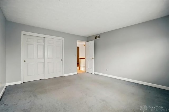 433 Vincent Ct, Middletown, OH 45042 - unfurnished bedroom with baseboards, a closet, and carpet flooring