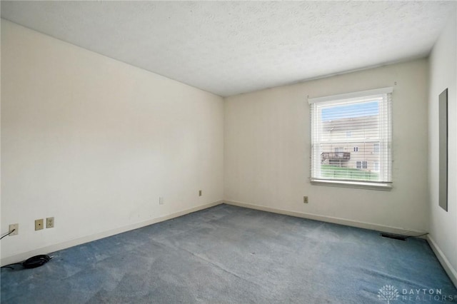 433 Vincent Ct, Middletown, OH 45042 - carpeted empty room with baseboards and a textured ceiling
