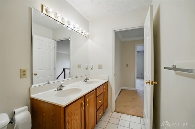 433 Vincent Ct, Middletown, OH 45042 - bathroom with tile patterned floors, double vanity, toilet, baseboards, and a textured ceiling