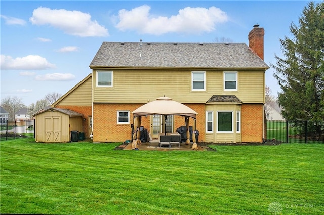 433 Vincent Ct, Middletown, OH 45042 - rear view of property with a gazebo, brick siding, a patio, a storage unit, and a chimney