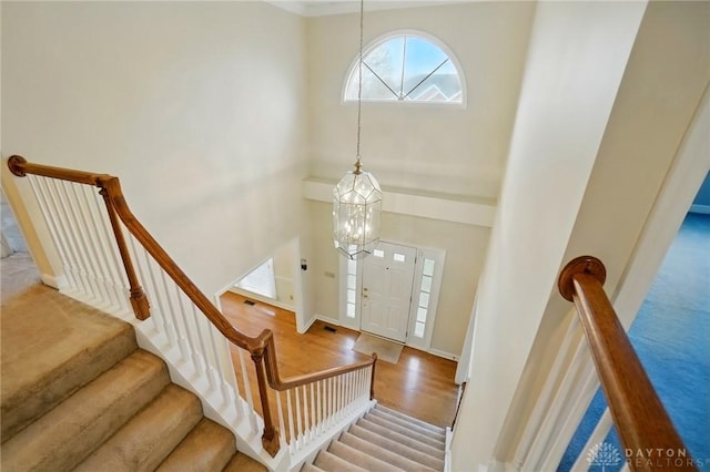 433 Vincent Ct, Middletown, OH 45042 - entrance foyer featuring a towering ceiling, a chandelier, stairway, baseboards, and wood finished floors