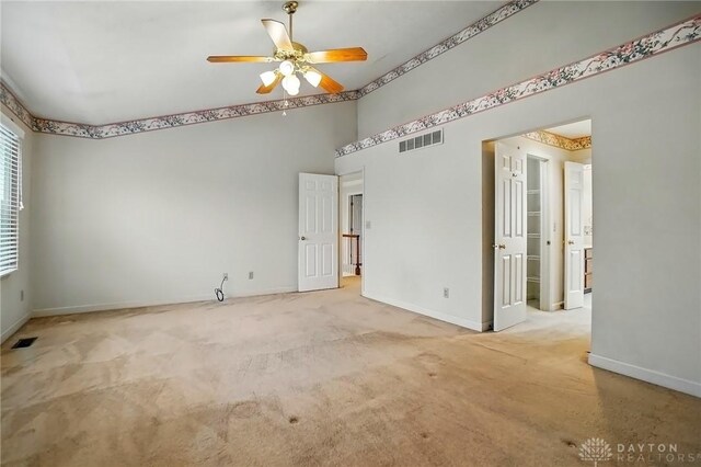 433 Vincent Ct, Middletown, OH 45042 - empty room with ceiling fan, baseboards, carpet, and a towering ceiling