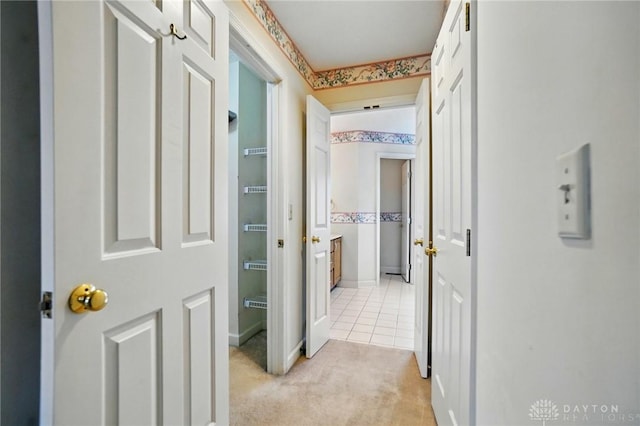 433 Vincent Ct, Middletown, OH 45042 - corridor featuring light carpet, baseboards, and light tile patterned floors