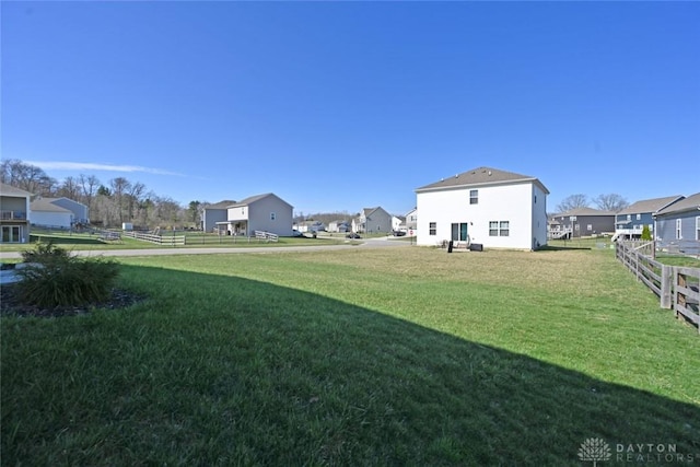 view of yard with fence and a residential view