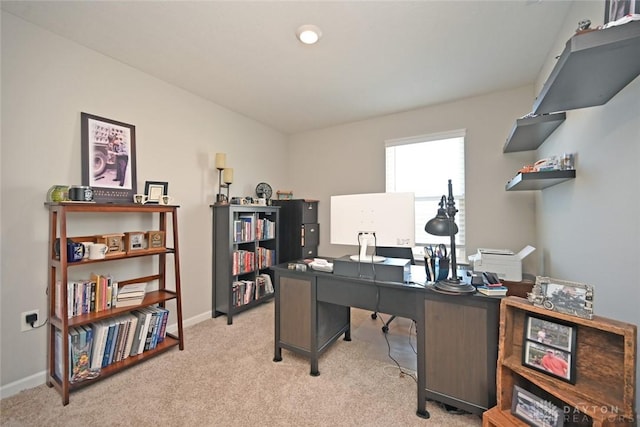 office space featuring light colored carpet and baseboards