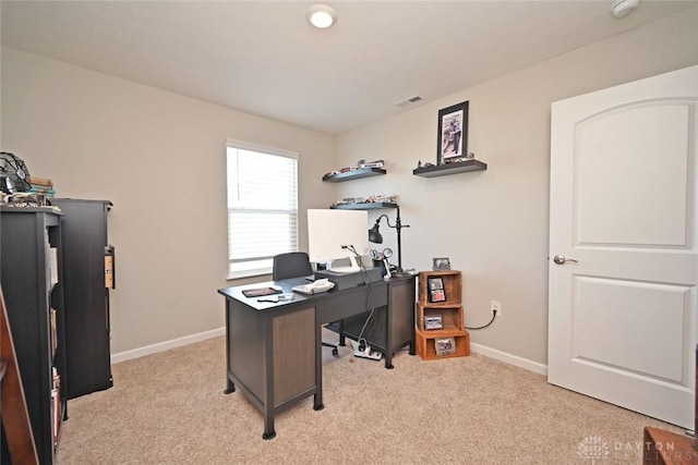 office with visible vents, light colored carpet, and baseboards