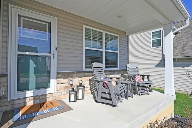 view of patio featuring a porch