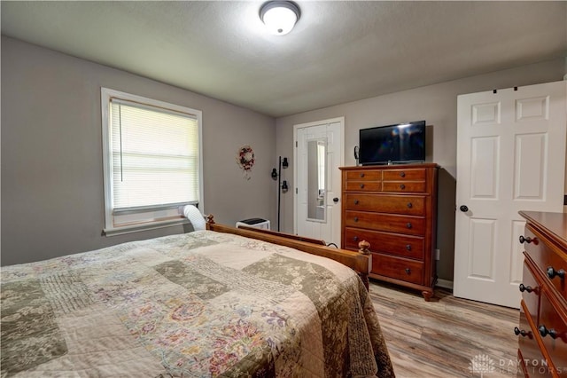 bedroom featuring light wood-style flooring