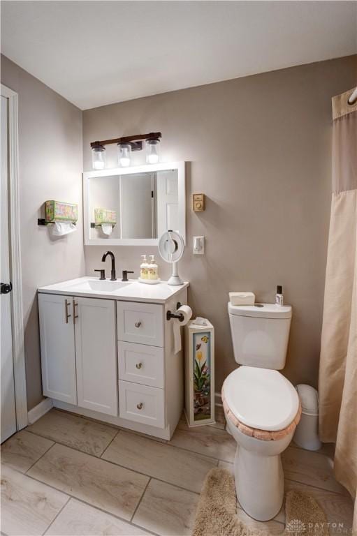 bathroom with toilet and vanity