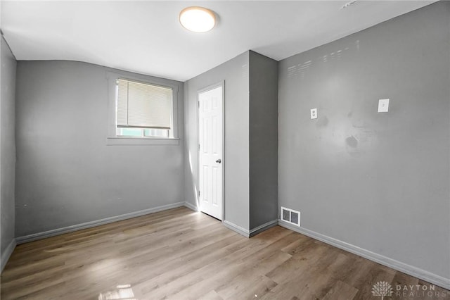 578 Wyoming St, Dayton, OH 45410 - empty room with visible vents, baseboards, and wood finished floors