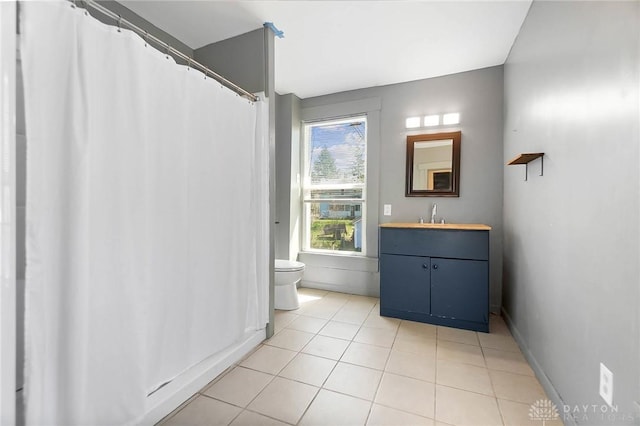 578 Wyoming St, Dayton, OH 45410 - bathroom with tile patterned floors, vanity, baseboards, and toilet