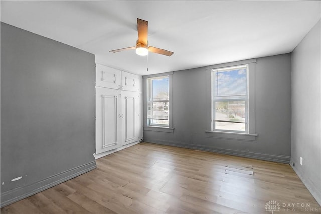 578 Wyoming St, Dayton, OH 45410 - empty room featuring ceiling fan, light wood finished floors, and baseboards