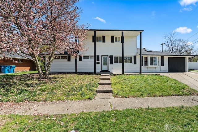 4433 Lambeth Dr, Dayton, OH 45424 - traditional-style house featuring a garage, entry steps, driveway, and a front yard