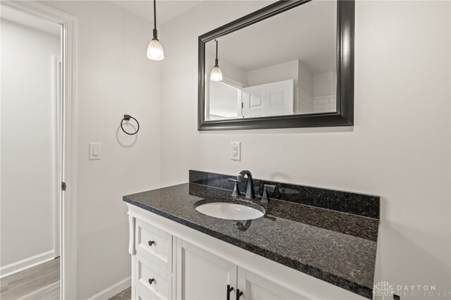 4433 Lambeth Dr, Dayton, OH 45424 - bathroom with vanity, baseboards, and wood finished floors