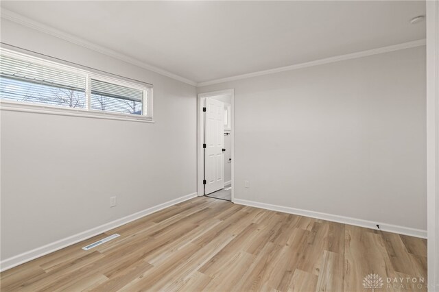 4433 Lambeth Dr, Dayton, OH 45424 - unfurnished room with baseboards, visible vents, ornamental molding, and light wood finished floors