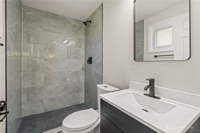4433 Lambeth Dr, Dayton, OH 45424 - bathroom with vanity, toilet, and tiled shower