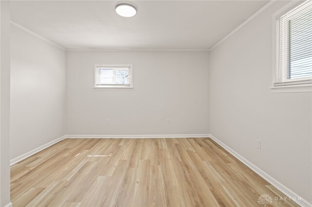 4433 Lambeth Dr, Dayton, OH 45424 - unfurnished room with crown molding, baseboards, and light wood-style floors