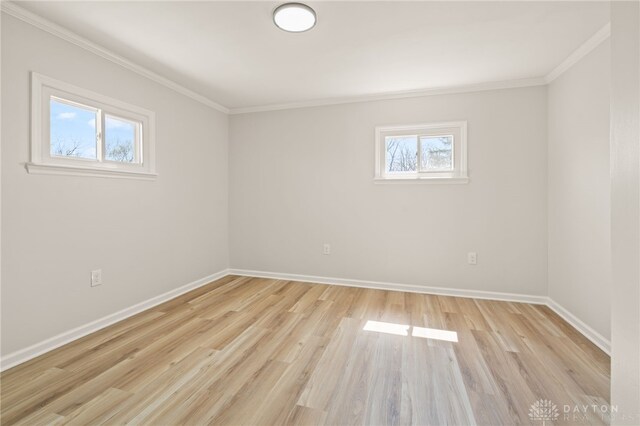 4433 Lambeth Dr, Dayton, OH 45424 - unfurnished room with crown molding, baseboards, and light wood-style flooring