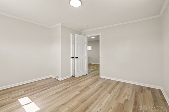 4433 Lambeth Dr, Dayton, OH 45424 - unfurnished room with crown molding, baseboards, and light wood finished floors