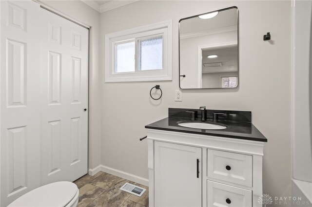 4433 Lambeth Dr, Dayton, OH 45424 - bathroom with crown molding, vanity, toilet, baseboards, and visible vents