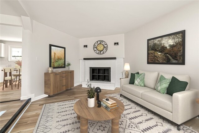 4433 Lambeth Dr, Dayton, OH 45424 - living area with baseboards, light wood-style flooring, and a brick fireplace