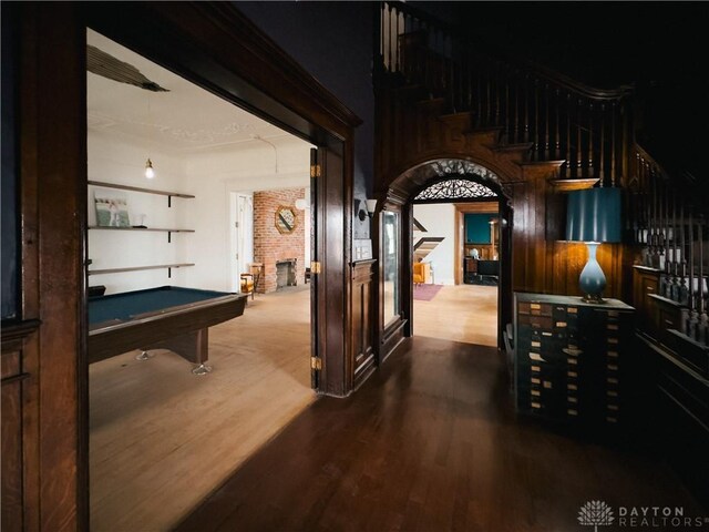 1400 E 3rd St, Dayton, OH 45403 - interior space featuring billiards, arched walkways, wood finished floors, and a fireplace