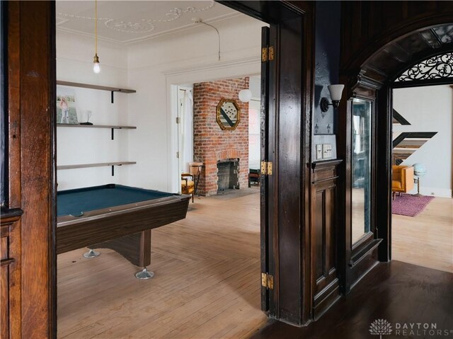 1400 E 3rd St, Dayton, OH 45403 - game room with billiards, parquet flooring, arched walkways, and a brick fireplace