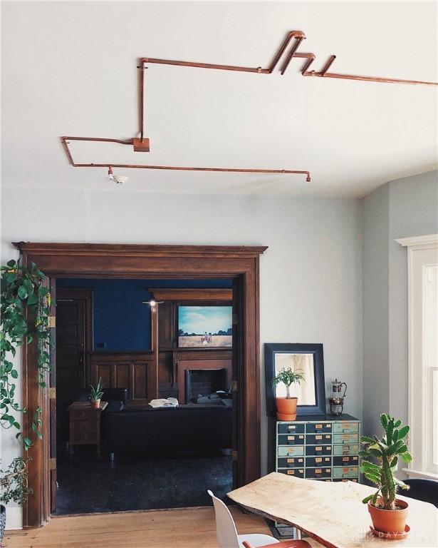 1400 E 3rd St, Dayton, OH 45403 - dining area featuring a fireplace and wood finished floors