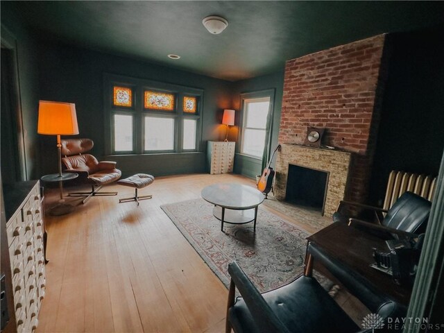1400 E 3rd St, Dayton, OH 45403 - living area with hardwood / wood-style flooring and a large fireplace
