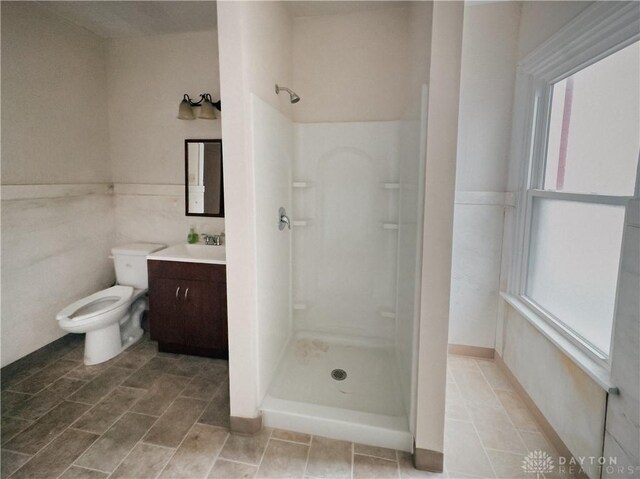 1400 E 3rd St, Dayton, OH 45403 - full bath featuring toilet, a stall shower, and vanity