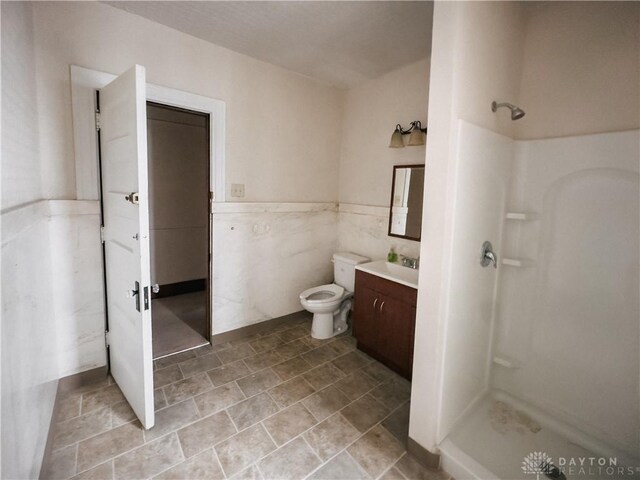 1400 E 3rd St, Dayton, OH 45403 - bathroom with toilet, a shower stall, and vanity