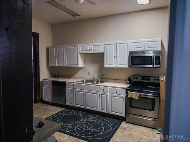 1400 E 3rd St, Dayton, OH 45403 - kitchen featuring a sink, light countertops, appliances with stainless steel finishes, a ceiling fan, and gray cabinets