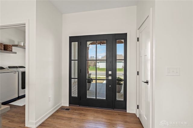2164 Northbridge Trl, Troy, OH 45373 - entryway with washer and dryer, wood finished floors, and baseboards