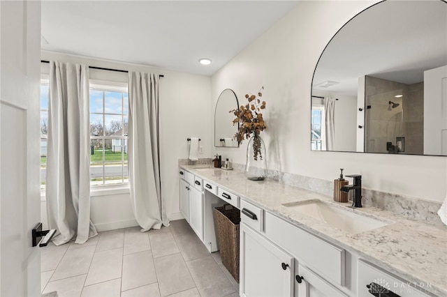 2164 Northbridge Trl, Troy, OH 45373 - kitchen featuring a sink, light tile patterned floors, white cabinets, light stone countertops, and baseboards